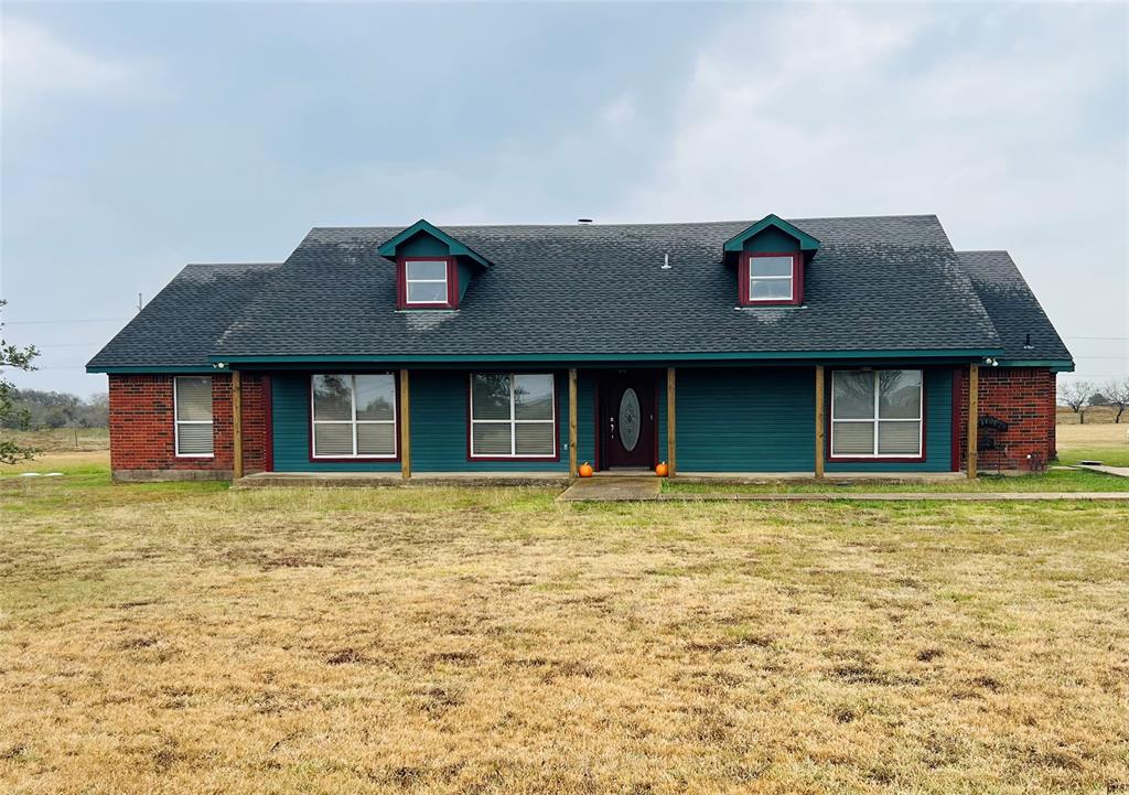 469 Streetman Road Royse City, TX 75189 - Photo 3 of 36 View of front of property with roof with shingles, a front yard, covered porch, and brick siding