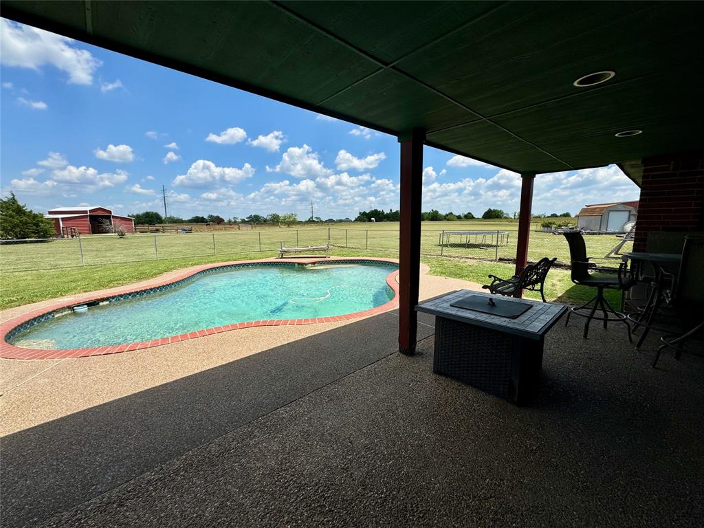 469 Streetman Road Royse City, TX 75189 - Photo 34 of 36 Pool with a rural view, a patio, a lawn, and a fenced backyard