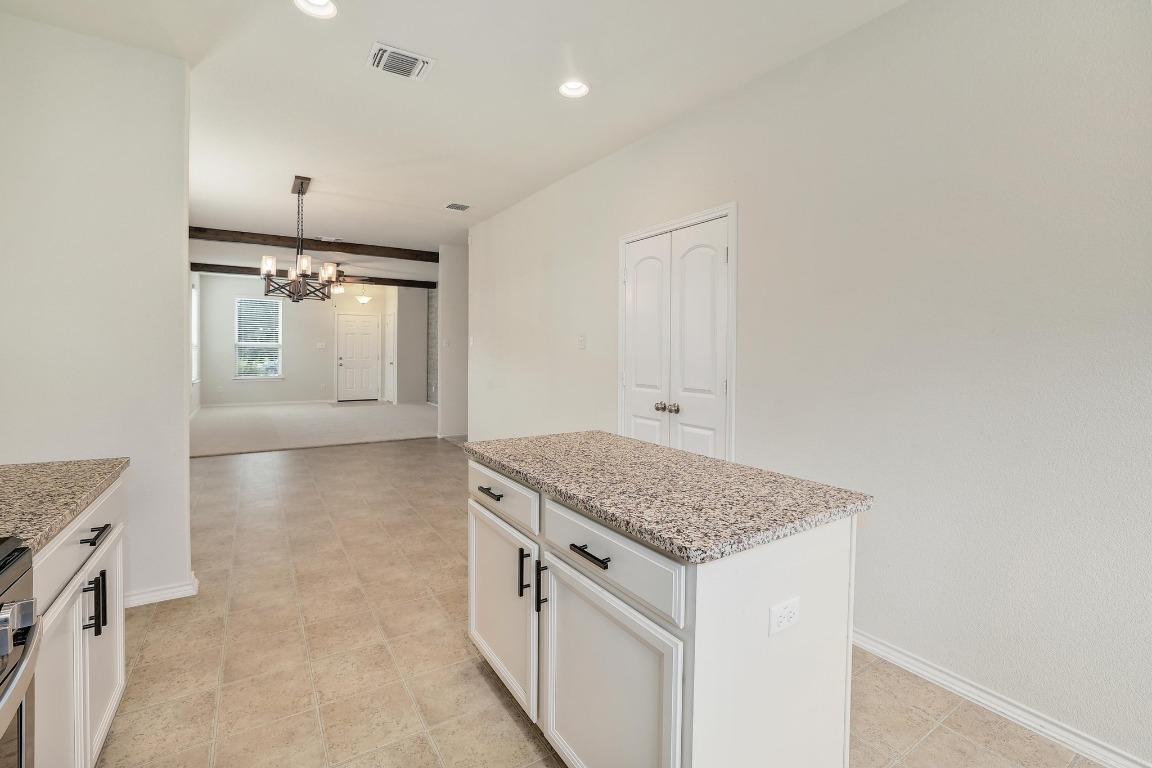 1924 Cliffbrake Way Georgetown, TX 78626 - Photo 13 of 27 a kitchen with a sink stove and cabinets