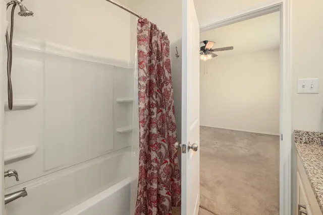 a bathroom with a bathtub and shower