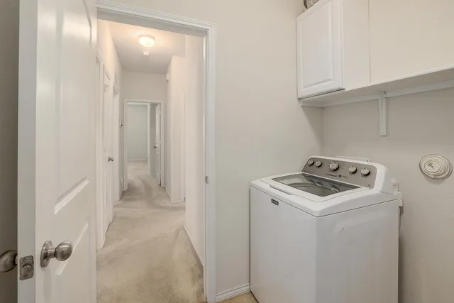a view of storage and utility room with washer and dryer