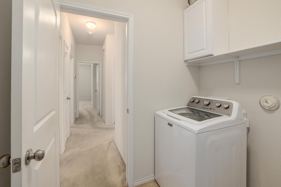 1924 Cliffbrake Way Georgetown, TX 78626 - Photo 23 of 27 a view of storage and utility room with washer and dryer
