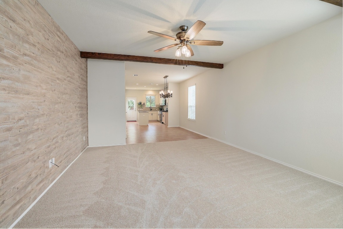 1924 Cliffbrake Way Georgetown, TX 78626 - Photo 6 of 27 wooden floor in an empty room with a chandelier