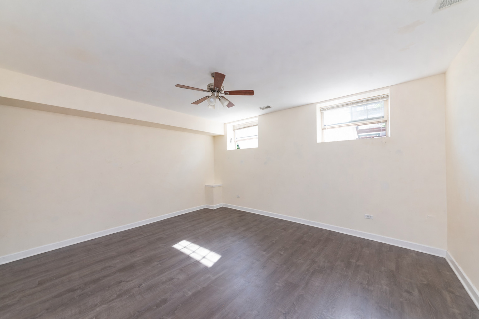 2415 West 24th Street, Unit 6 Chicago, IL 60608 - Photo 4 of 12 a view of an empty room with a window