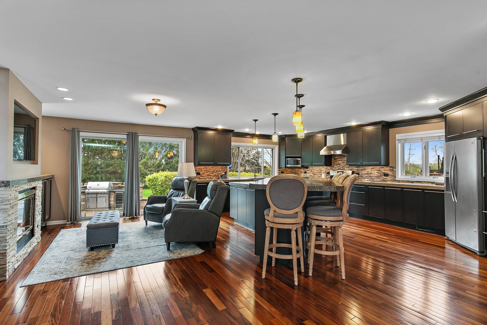 39W343 Hogan Hill Elgin, IL 60124 - Photo 11 of 48 a living room with furniture and a fireplace