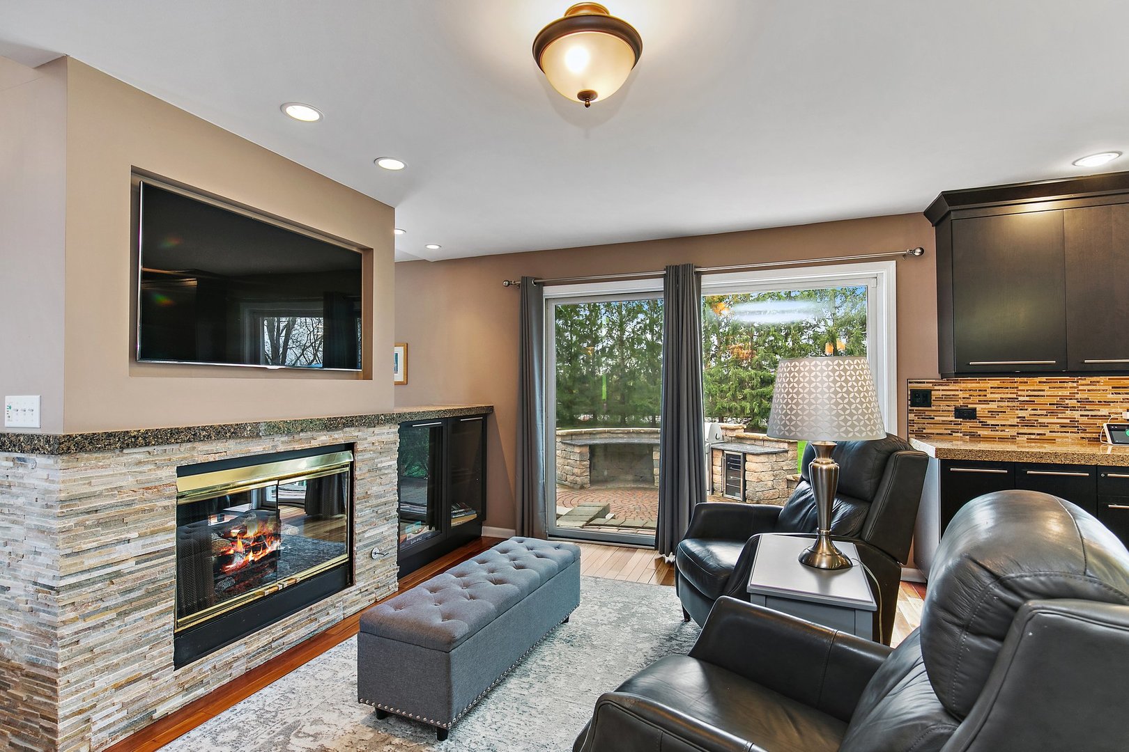 39W343 Hogan Hill Elgin, IL 60124 - Photo 12 of 48 a living room with furniture a flat screen tv and a fireplace