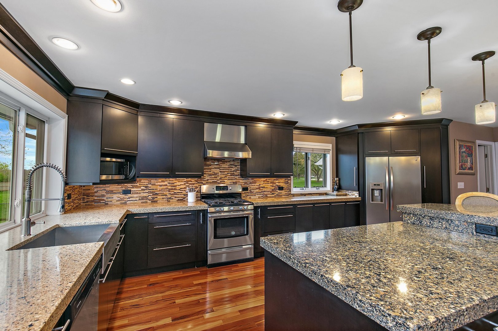 39W343 Hogan Hill Elgin, IL 60124 - Photo 14 of 48 a open kitchen with stainless steel appliances granite countertop a stove and a sink