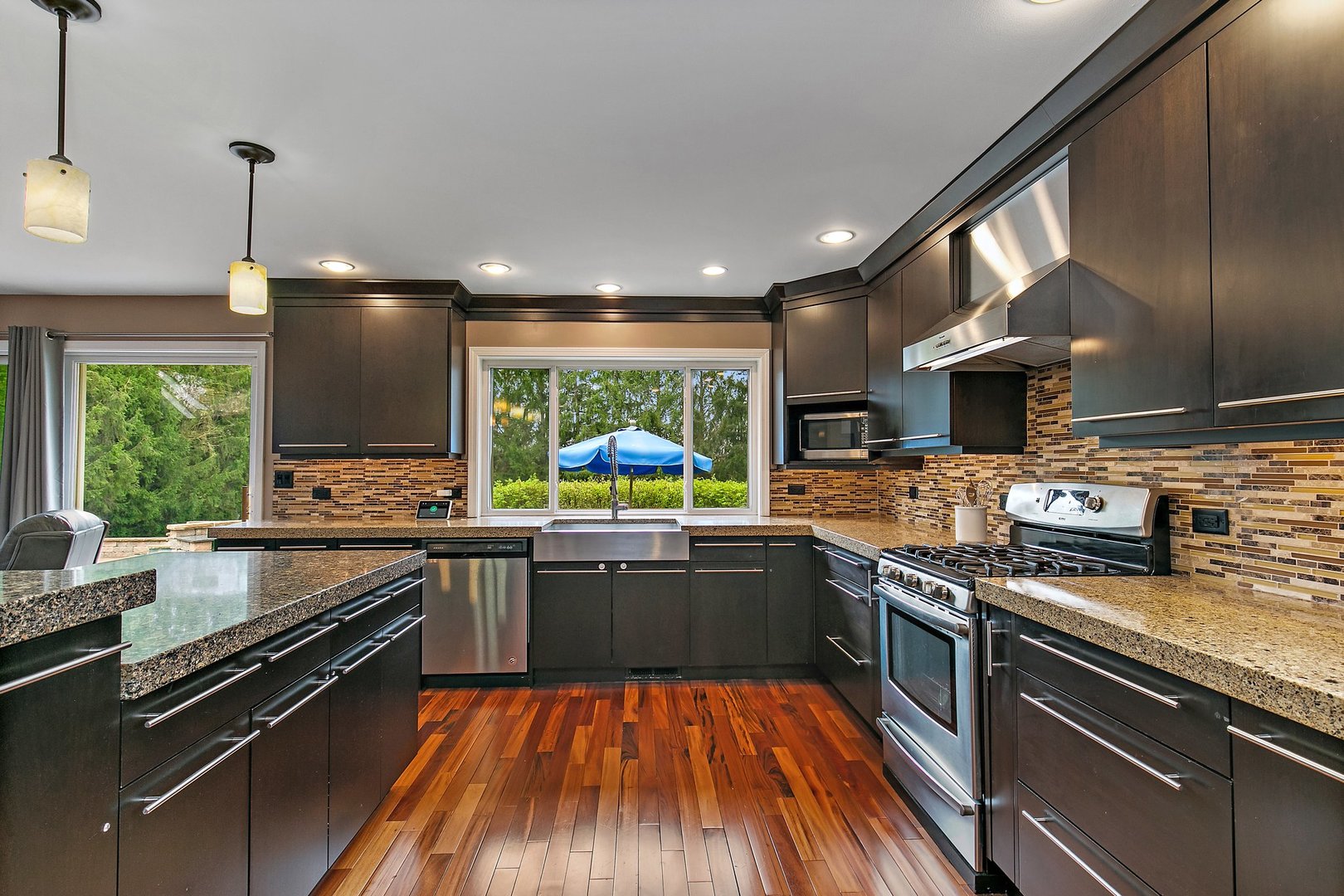 39W343 Hogan Hill Elgin, IL 60124 - Photo 16 of 48 a kitchen with stainless steel appliances granite countertop sink stove and refrigerator