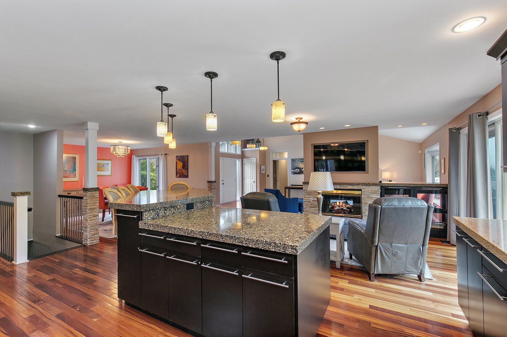39W343 Hogan Hill Elgin, IL 60124 - Photo 18 of 48 a view of a living room and kitchen with furniture wooden floor