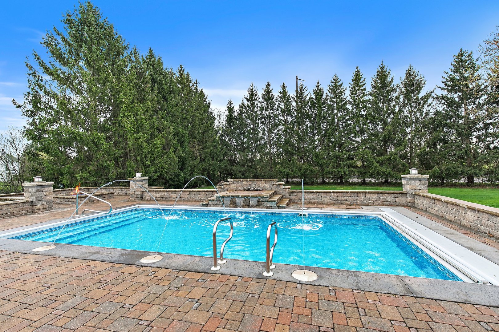 39W343 Hogan Hill Elgin, IL 60124 - Photo 38 of 48 a view of a swimming pool with a lounge chair