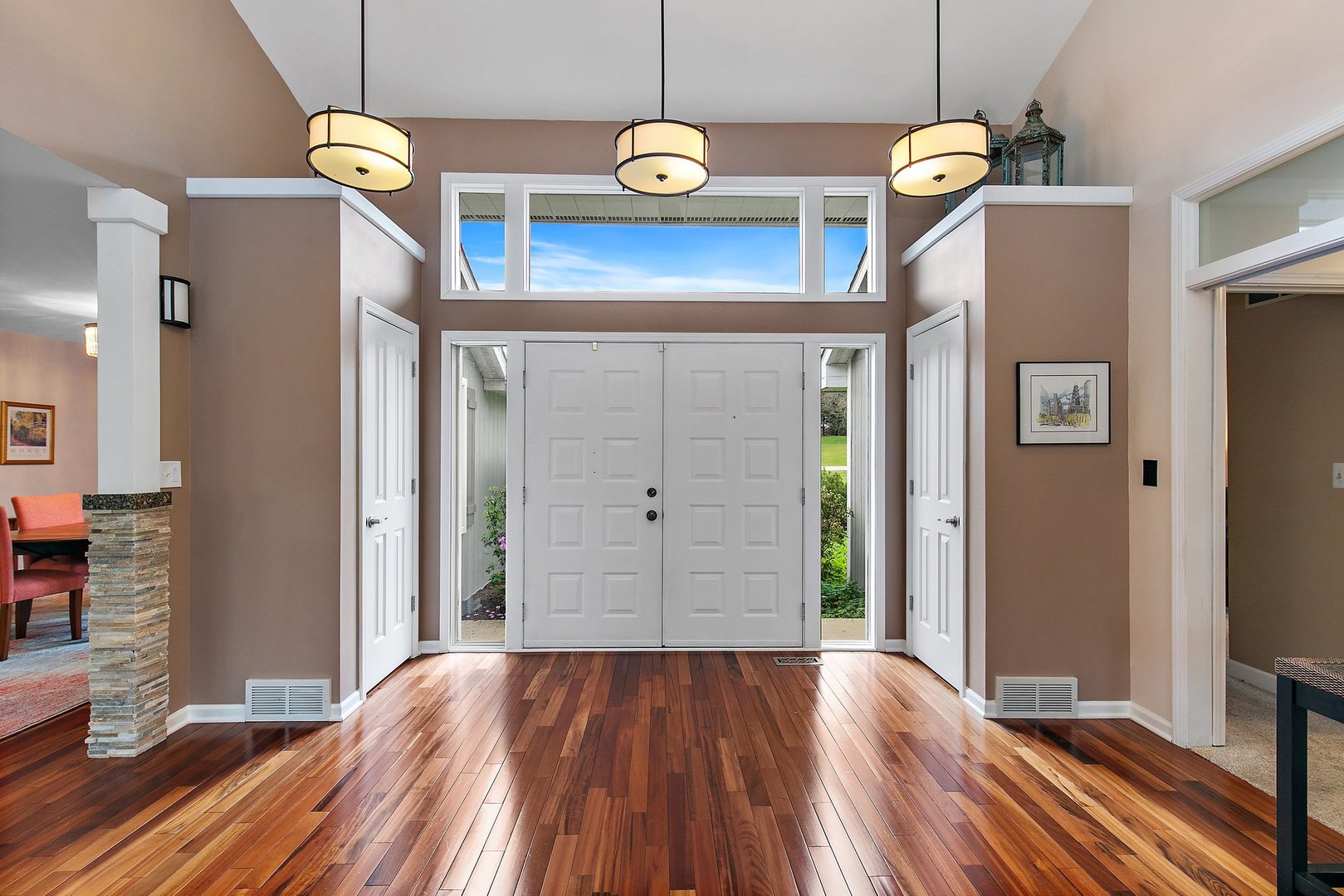 39W343 Hogan Hill Elgin, IL 60124 - Photo 4 of 48 a view of a livingroom with wooden floor and staircase