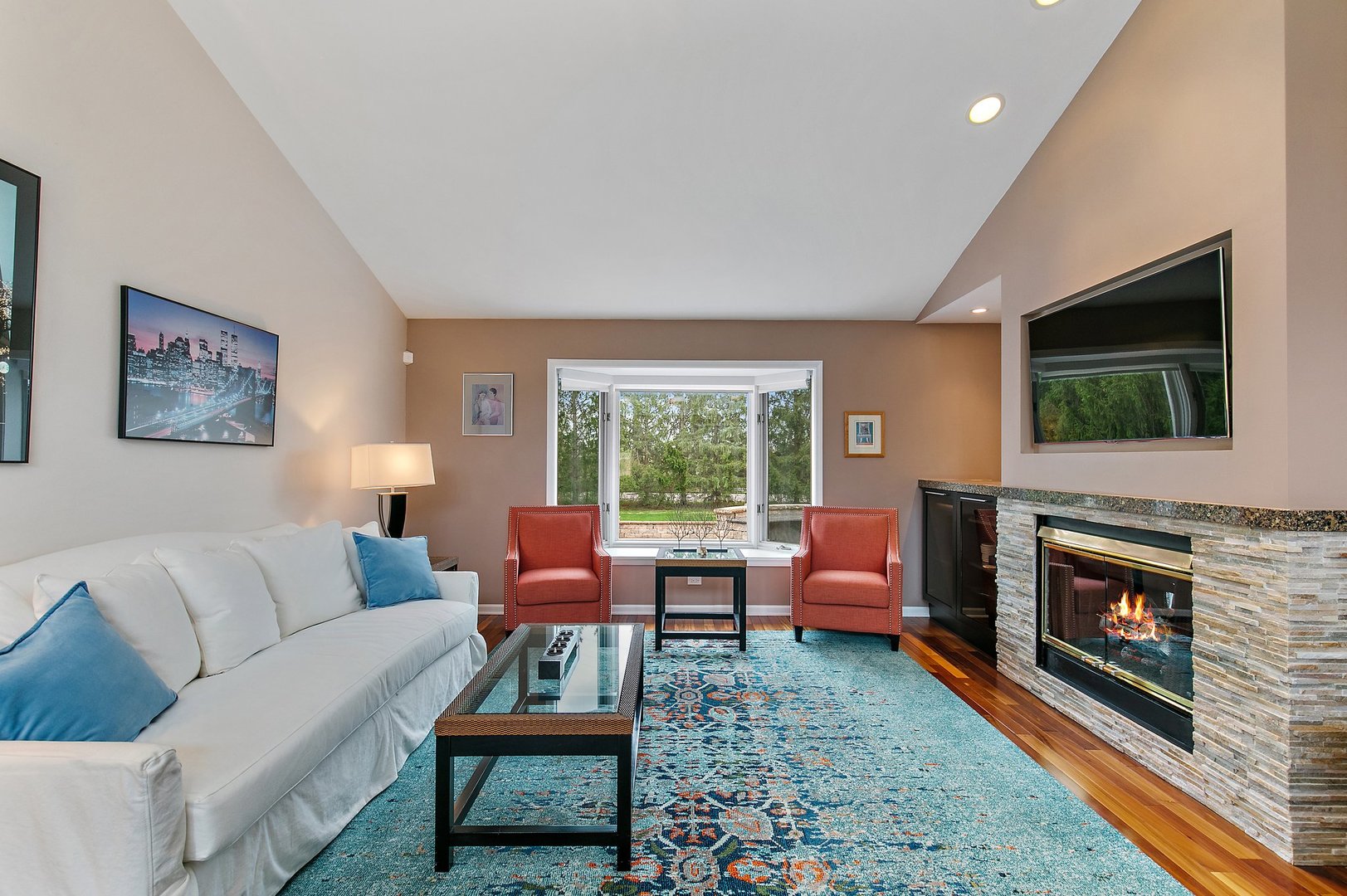 39W343 Hogan Hill Elgin, IL 60124 - Photo 6 of 48 a living room with furniture a flat screen tv and a fireplace