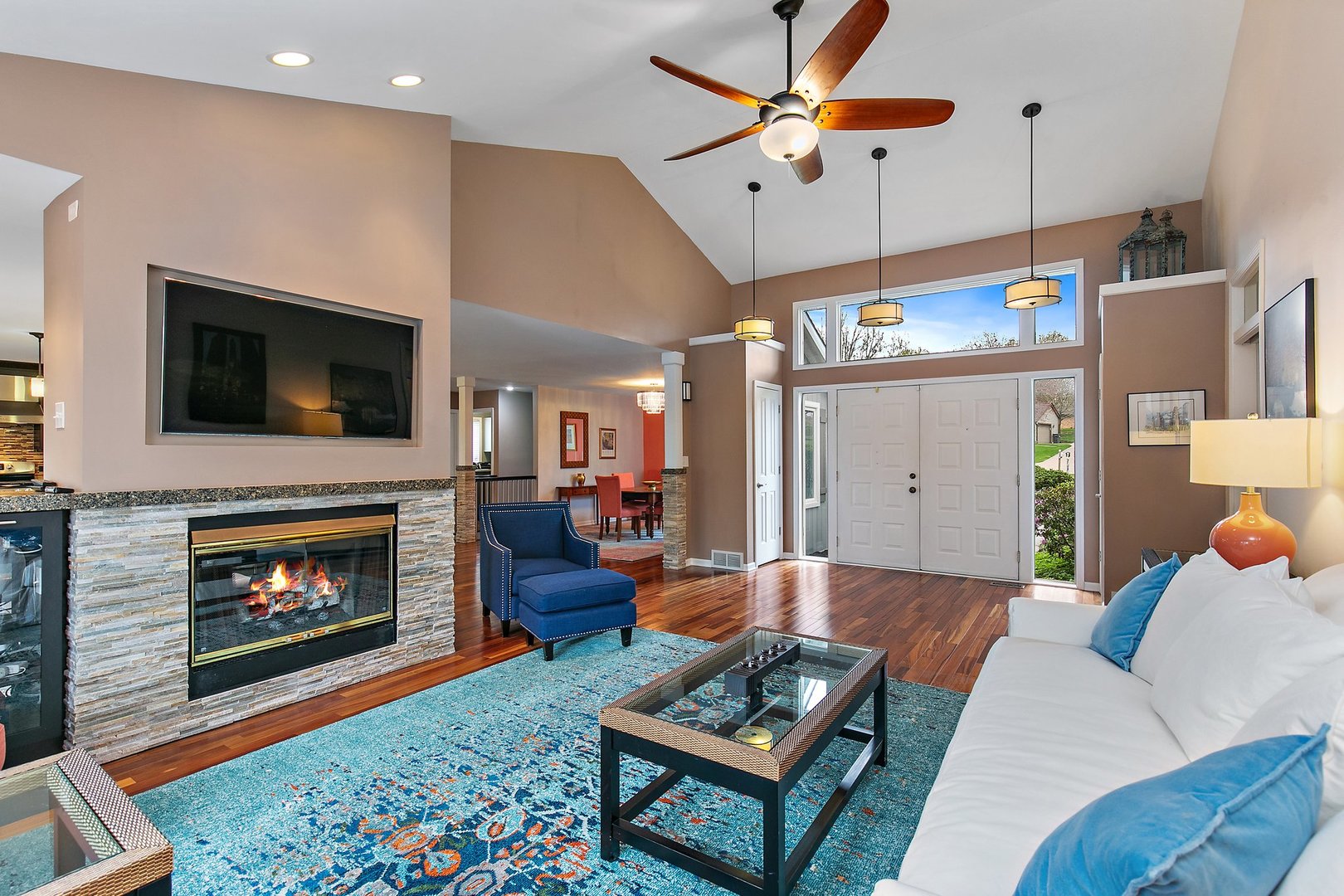 39W343 Hogan Hill Elgin, IL 60124 - Photo 7 of 48 a living room with furniture a flat screen tv and a fireplace