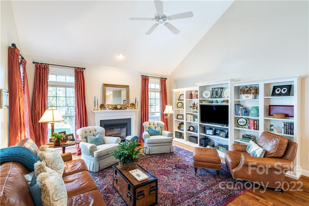 908 Gardenia Street Fort Mill, SC 29708 - Photo 12 of 39 a living room with fireplace furniture and a flat screen tv