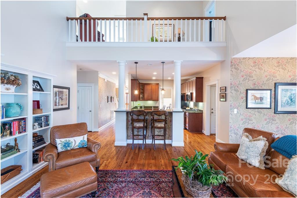 908 Gardenia Street Fort Mill, SC 29708 - Photo 13 of 39 a living room with furniture and a book shelf