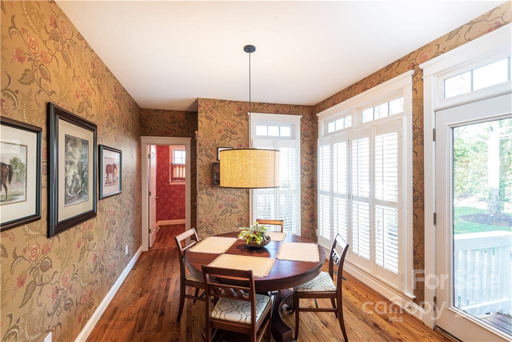 908 Gardenia Street Fort Mill, SC 29708 - Photo 14 of 39 a view of a dining room with furniture window and wooden floor