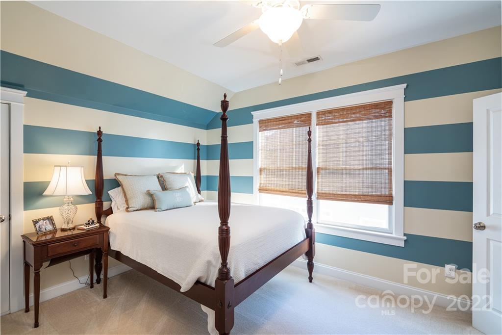 908 Gardenia Street Fort Mill, SC 29708 - Photo 18 of 39 a bedroom with a bed and a large window
