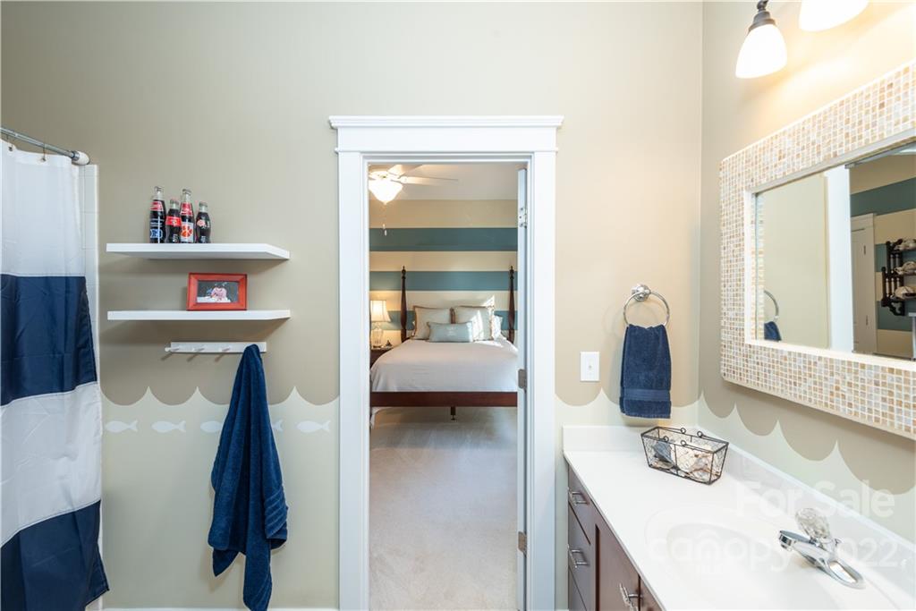908 Gardenia Street Fort Mill, SC 29708 - Photo 20 of 39 a bedroom with a bed and a mirror