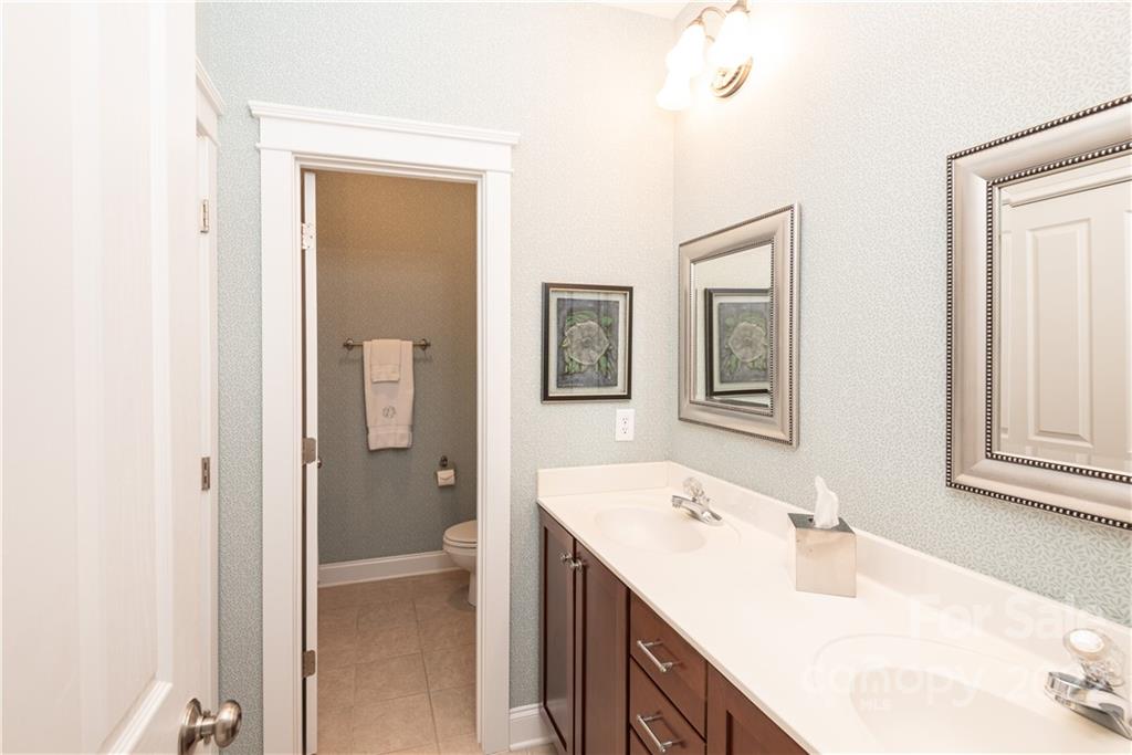 908 Gardenia Street Fort Mill, SC 29708 - Photo 23 of 39 a bathroom with a sink and a mirror