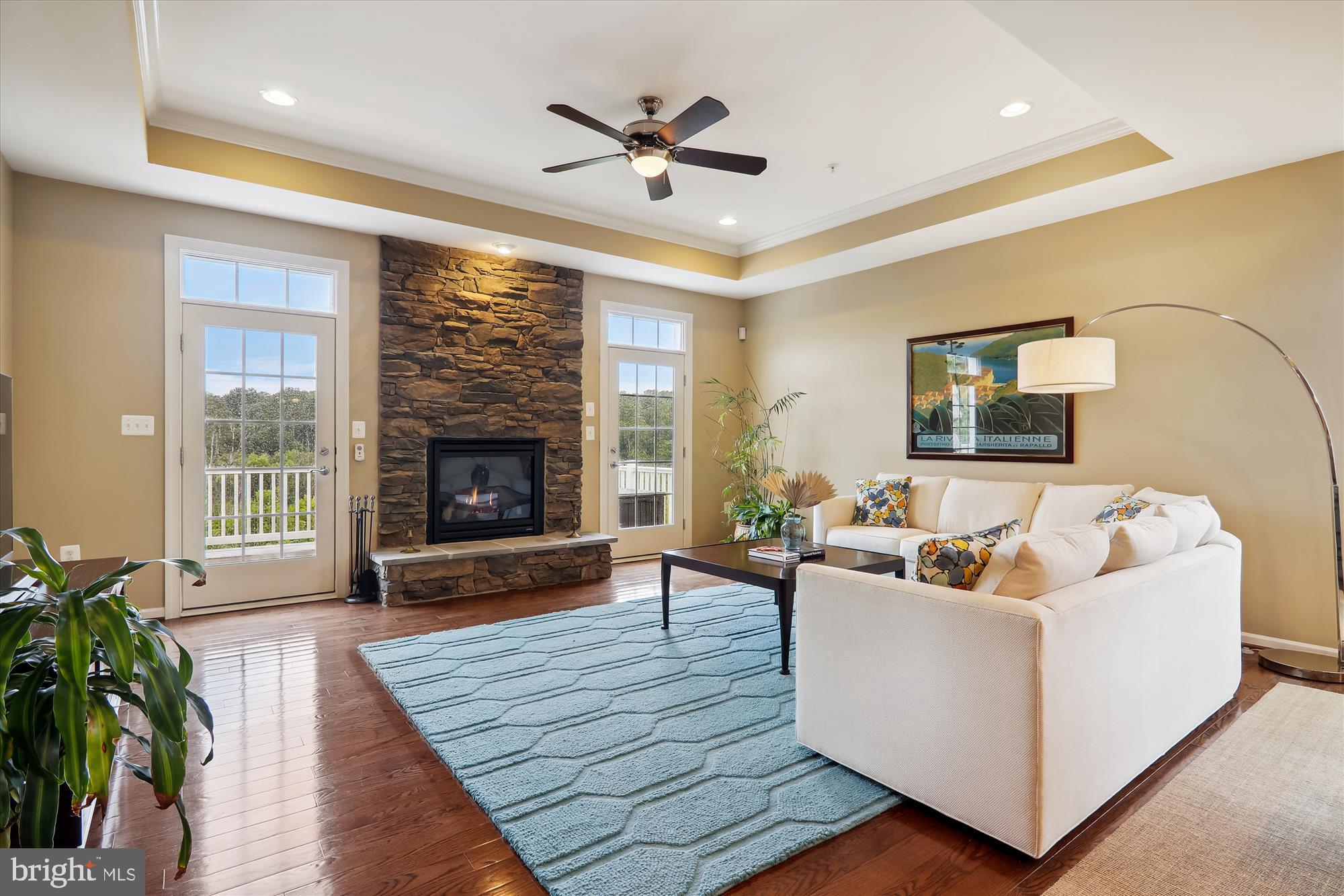 13327 Redspire Drive Silver Spring, MD 20906 - Photo 29 of 90 Stone fireplace and doors opening to expanded deck