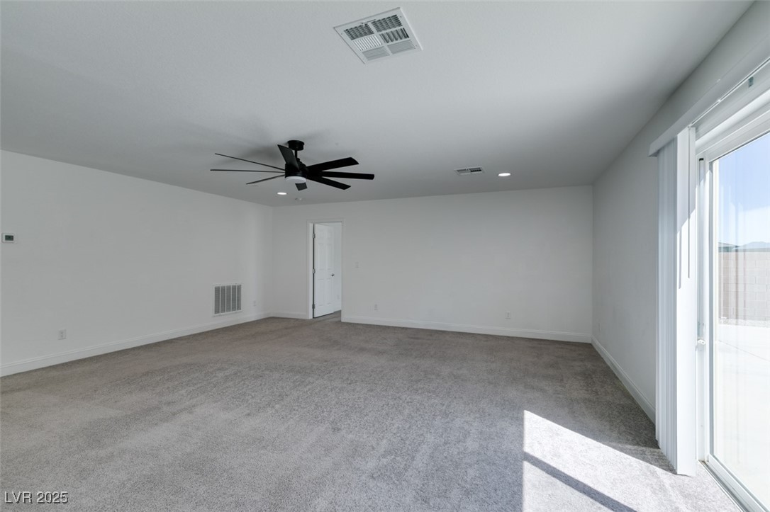 6335 Rock Strm Lane Las Vegas, NV 89141 - Photo 12 of 61 Spare room featuring light colored carpet, a ceiling fan, and recessed lighting