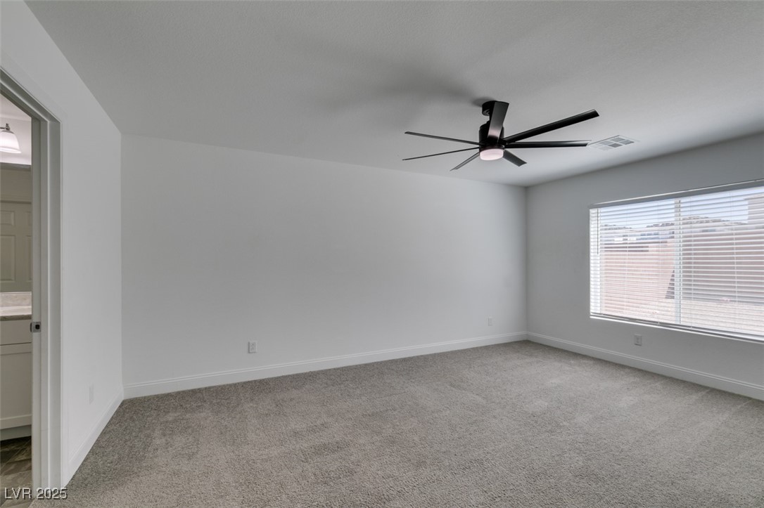 6335 Rock Strm Lane Las Vegas, NV 89141 - Photo 13 of 61 Unfurnished room with light colored carpet