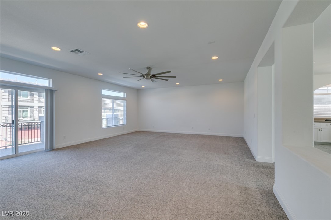 6335 Rock Strm Lane Las Vegas, NV 89141 - Photo 17 of 61 Unfurnished room featuring plenty of natural light, recessed lighting, light carpet, and a ceiling fan