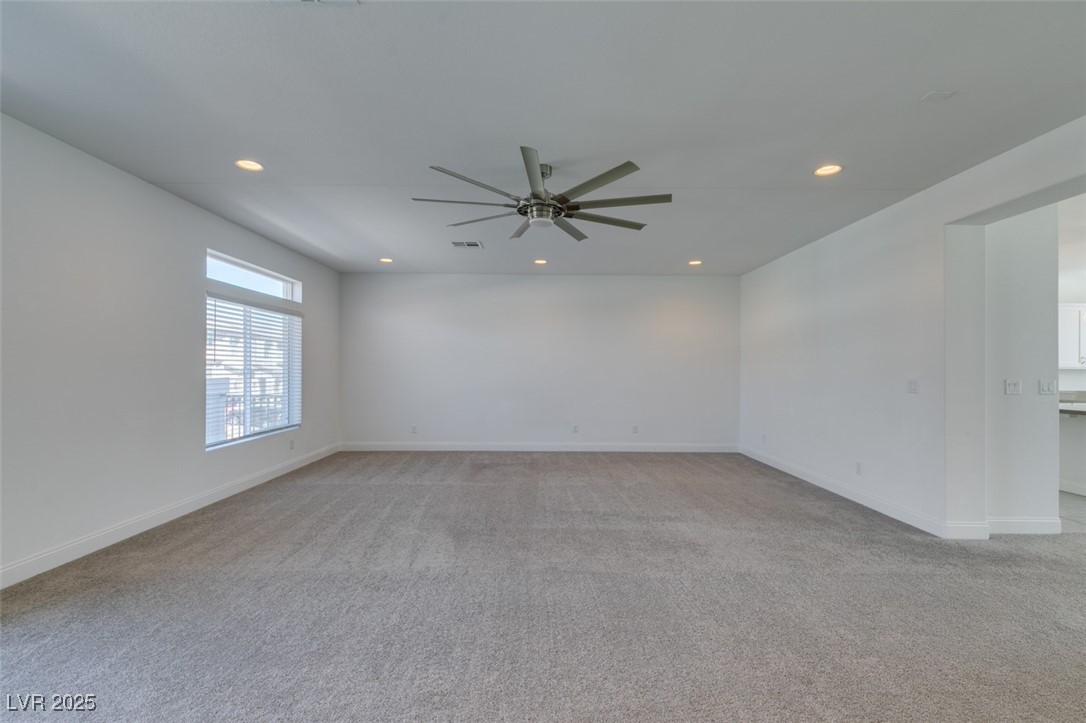 6335 Rock Strm Lane Las Vegas, NV 89141 - Photo 19 of 61 Unfurnished room featuring light carpet, recessed lighting, and a ceiling fan