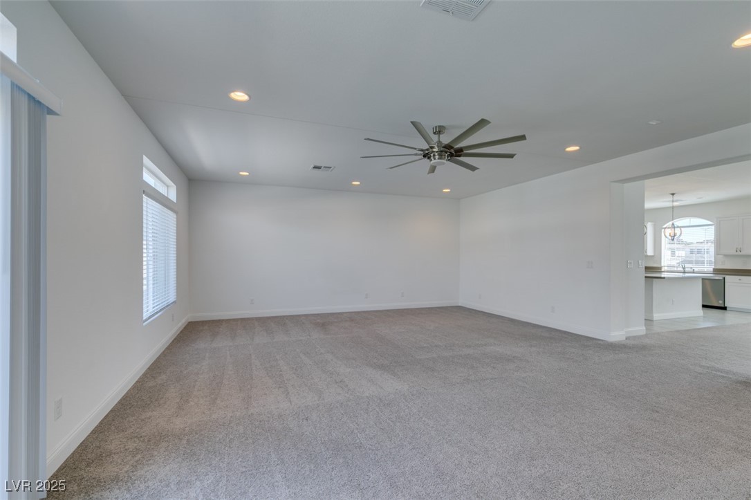 6335 Rock Strm Lane Las Vegas, NV 89141 - Photo 20 of 61 Spare room featuring light carpet, recessed lighting, and ceiling fan
