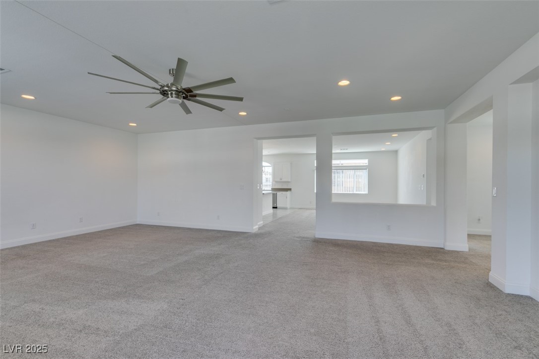 6335 Rock Strm Lane Las Vegas, NV 89141 - Photo 21 of 61 Spare room with recessed lighting, light colored carpet, and ceiling fan