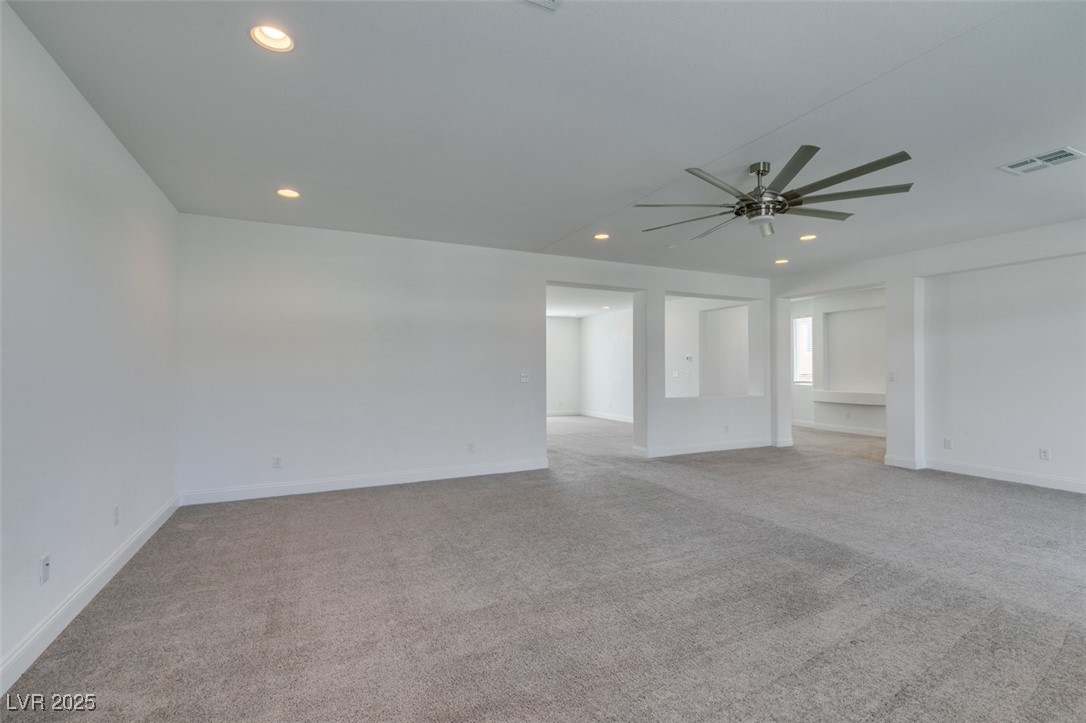 6335 Rock Strm Lane Las Vegas, NV 89141 - Photo 27 of 61 Spare room with light carpet, recessed lighting, and ceiling fan