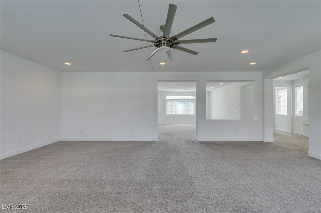 6335 Rock Strm Lane Las Vegas, NV 89141 - Photo 28 of 61 Unfurnished room with light carpet, recessed lighting, and ceiling fan