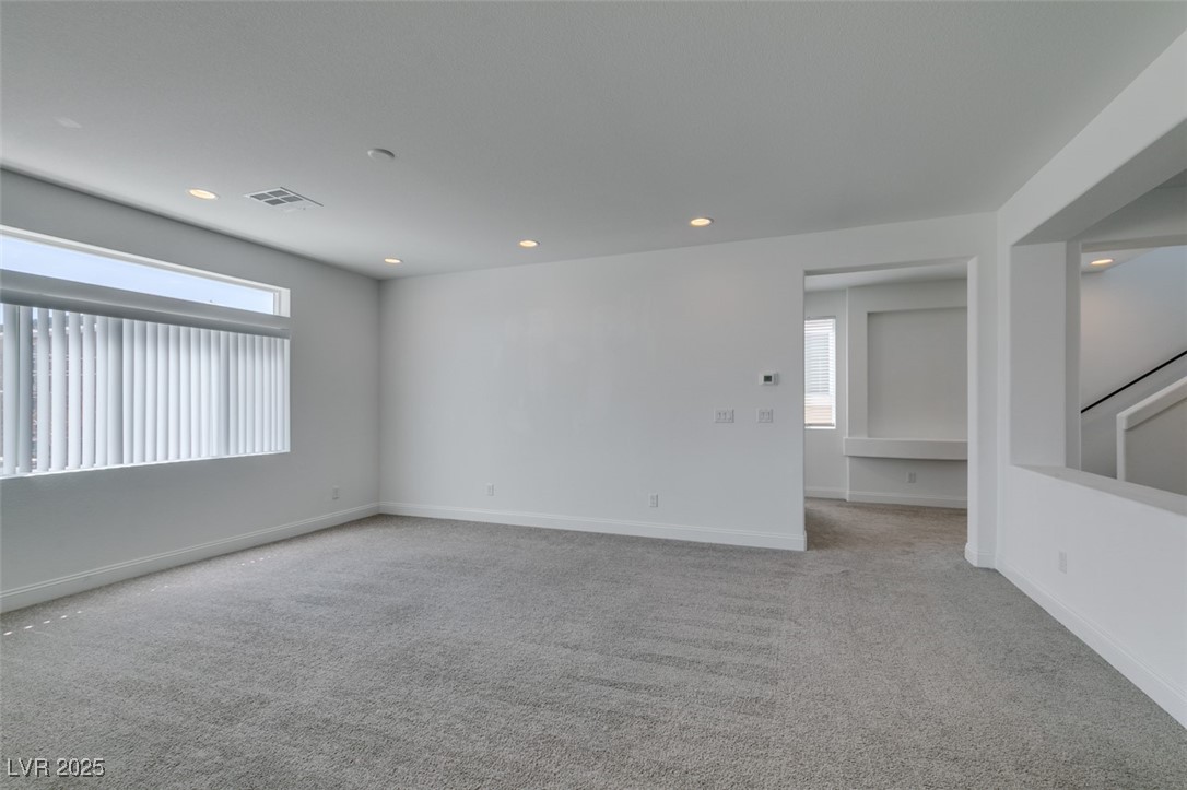 6335 Rock Strm Lane Las Vegas, NV 89141 - Photo 30 of 61 Empty room with light carpet and recessed lighting