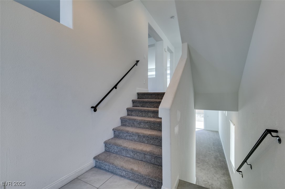 6335 Rock Strm Lane Las Vegas, NV 89141 - Photo 3 of 61 Stairs featuring tile patterned flooring and baseboards