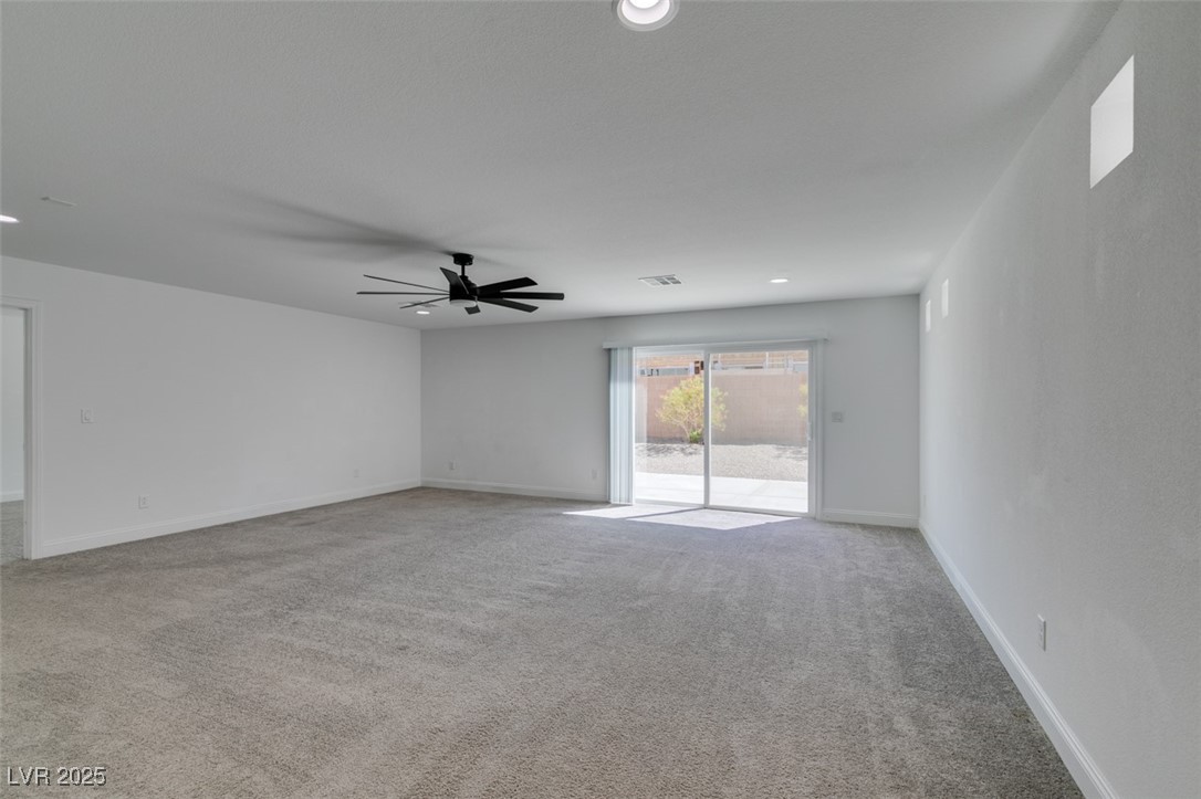 6335 Rock Strm Lane Las Vegas, NV 89141 - Photo 4 of 61 Unfurnished room featuring light colored carpet, recessed lighting, and ceiling fan