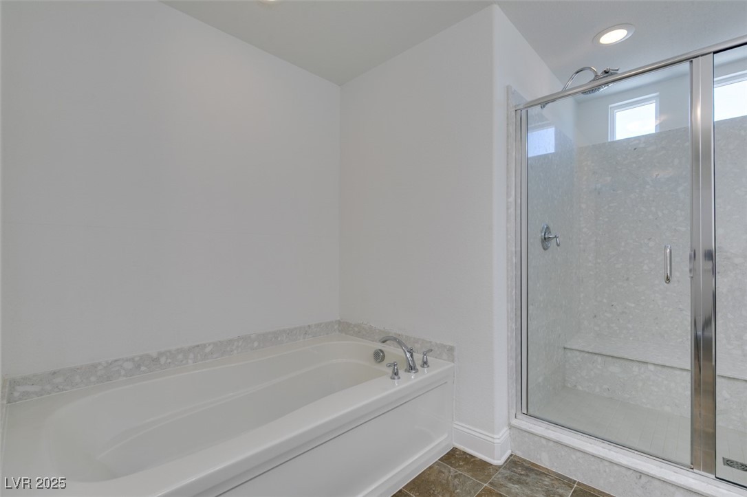 6335 Rock Strm Lane Las Vegas, NV 89141 - Photo 54 of 61 Bathroom with a stall shower, a garden tub, dark tile patterned floors, and recessed lighting