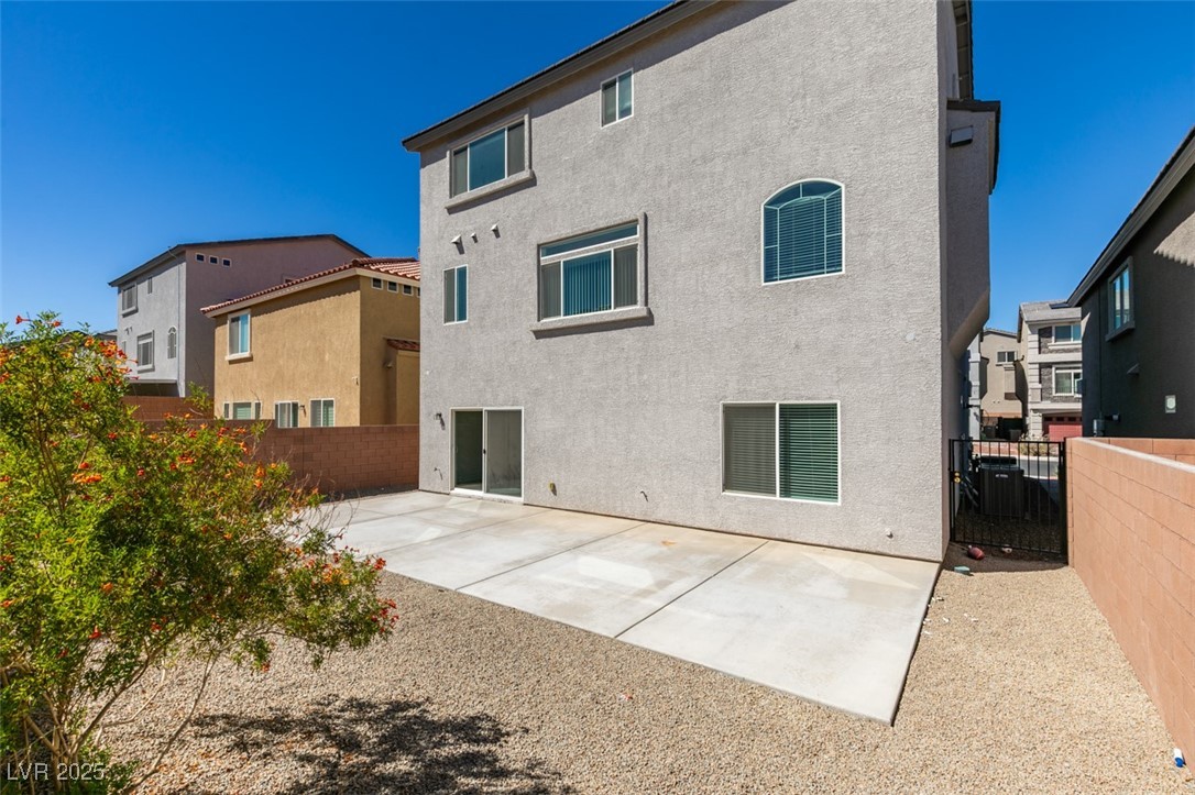 6335 Rock Strm Lane Las Vegas, NV 89141 - Photo 58 of 61 Rear view of house with a patio area, stucco siding, and a fenced backyard