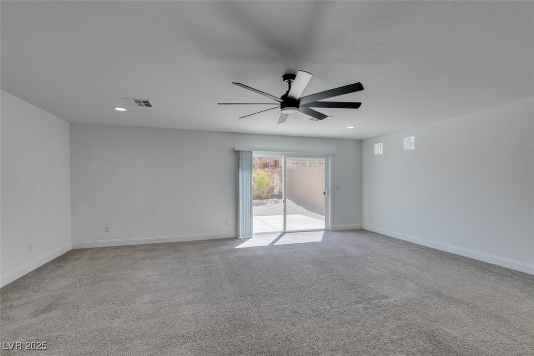 6335 Rock Strm Lane Las Vegas, NV 89141 - Photo 6 of 61 Unfurnished room with light colored carpet and recessed lighting