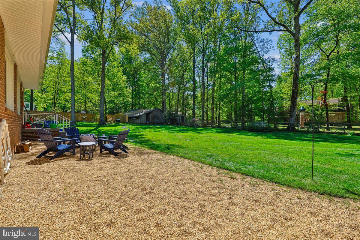 4318 Pinetree Road Rockville, MD 20853 - Photo 114 of 130 a view of a park with plants and a bench and trees