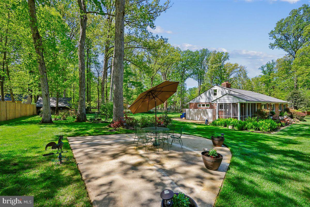 4318 Pinetree Road Rockville, MD 20853 - Photo 117 of 130 a view of a house with backyard sitting area and garden