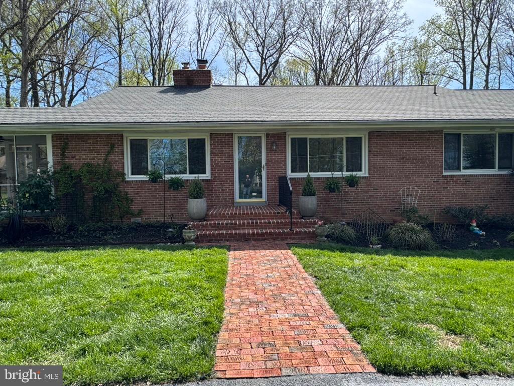 4318 Pinetree Road Rockville, MD 20853 - Photo 17 of 130 a front view of a house with a yard and porch