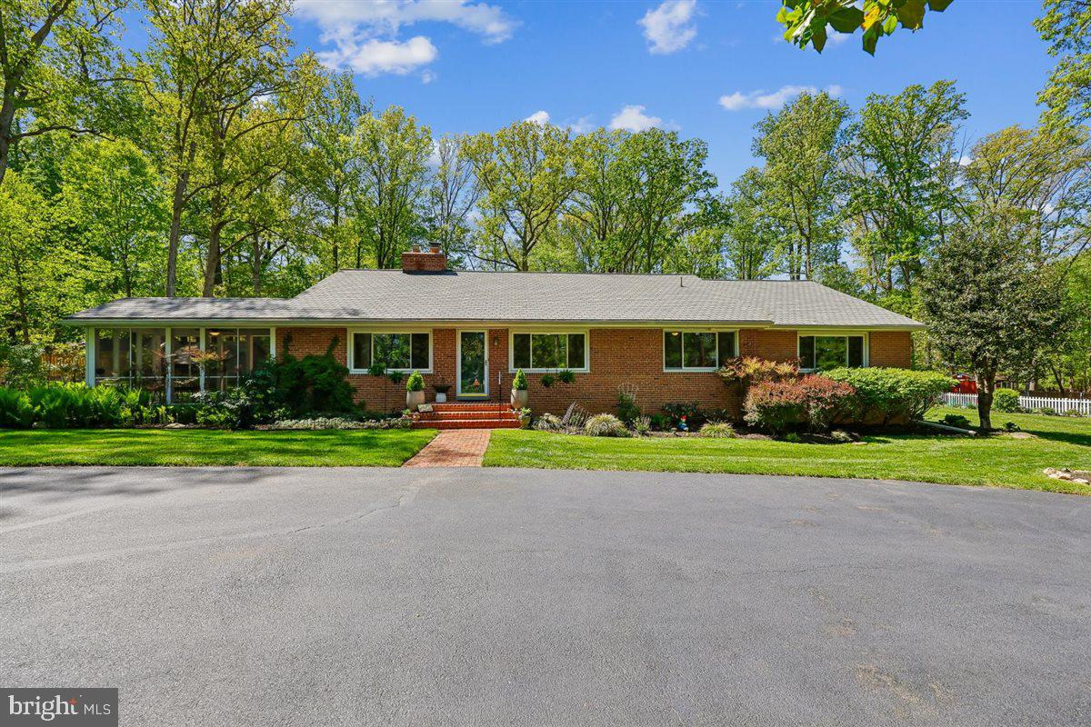 4318 Pinetree Road Rockville, MD 20853 - Photo 2 of 130 a front view of a house with a yard and porch