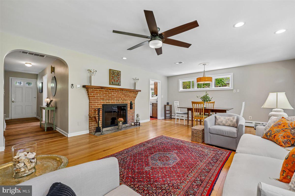 4318 Pinetree Road Rockville, MD 20853 - Photo 34 of 130 a living room with furniture and a fireplace