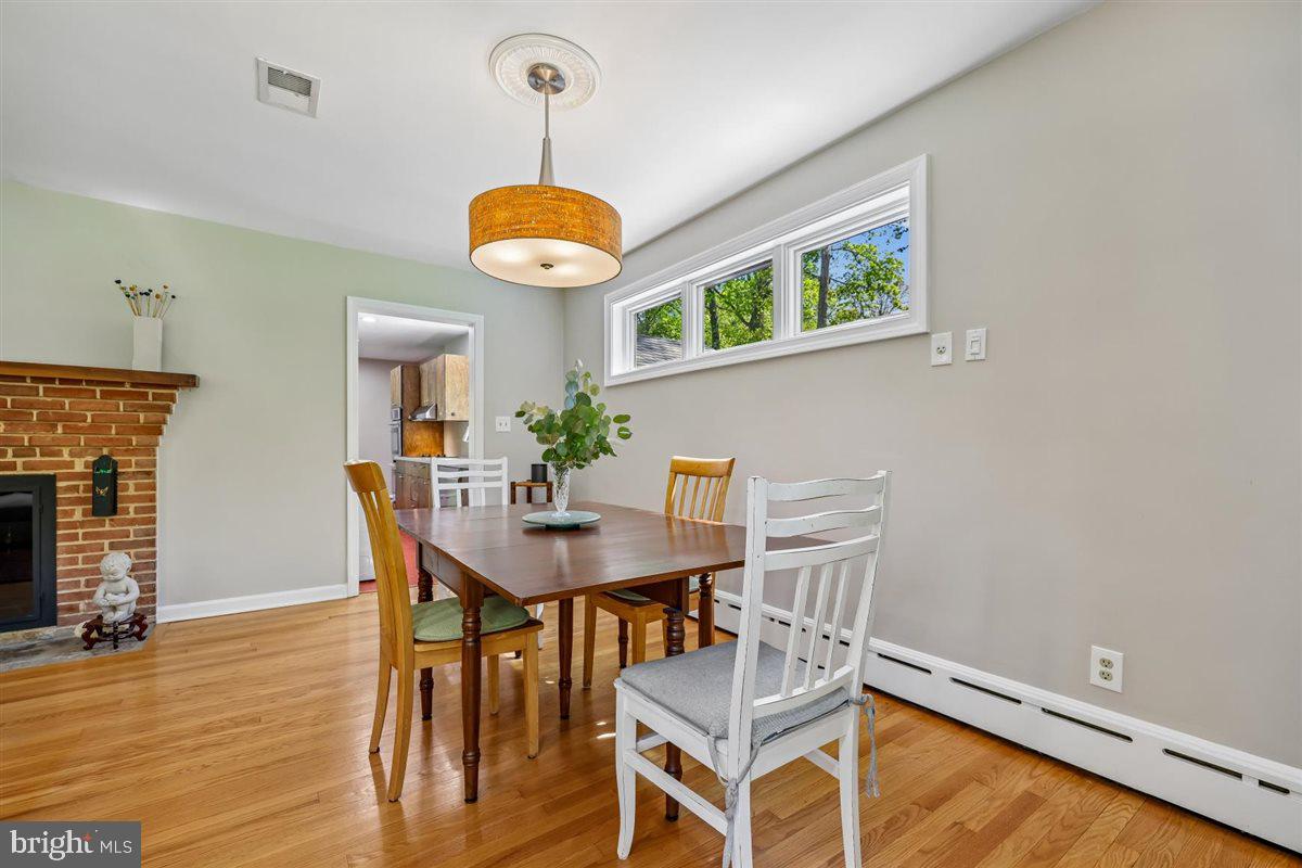 4318 Pinetree Road Rockville, MD 20853 - Photo 51 of 130 a view of a dining room with furniture and wooden floor