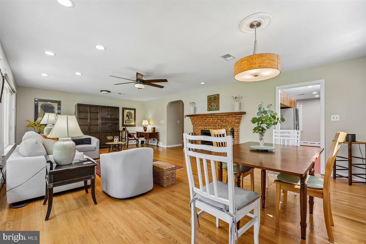 4318 Pinetree Road Rockville, MD 20853 - Photo 52 of 130 a living room with furniture kitchen view and a wooden floor