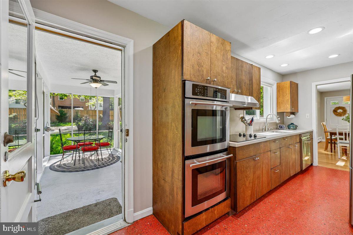 4318 Pinetree Road Rockville, MD 20853 - Photo 58 of 130 a kitchen with stainless steel appliances granite countertop a stove a sink and a refrigerator