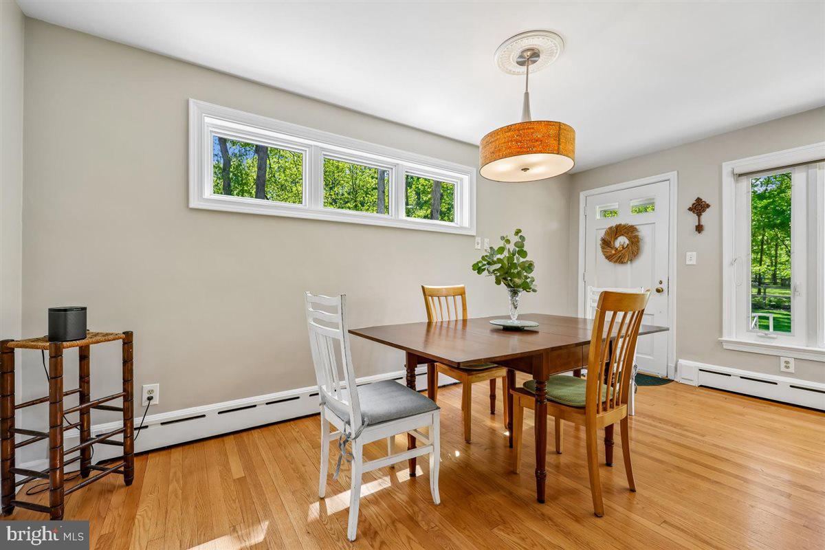 4318 Pinetree Road Rockville, MD 20853 - Photo 59 of 130 a view of a dining room with furniture window and wooden floor