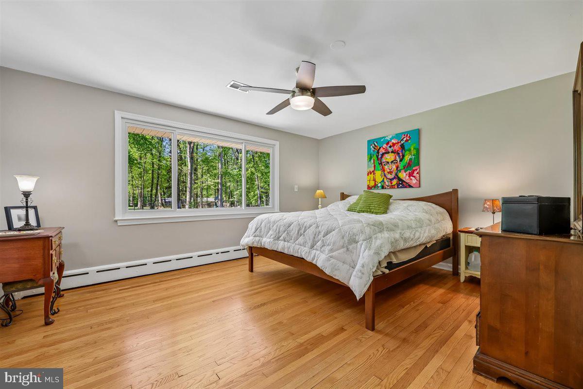 4318 Pinetree Road Rockville, MD 20853 - Photo 65 of 130 a bedroom with a bed dresser and a window
