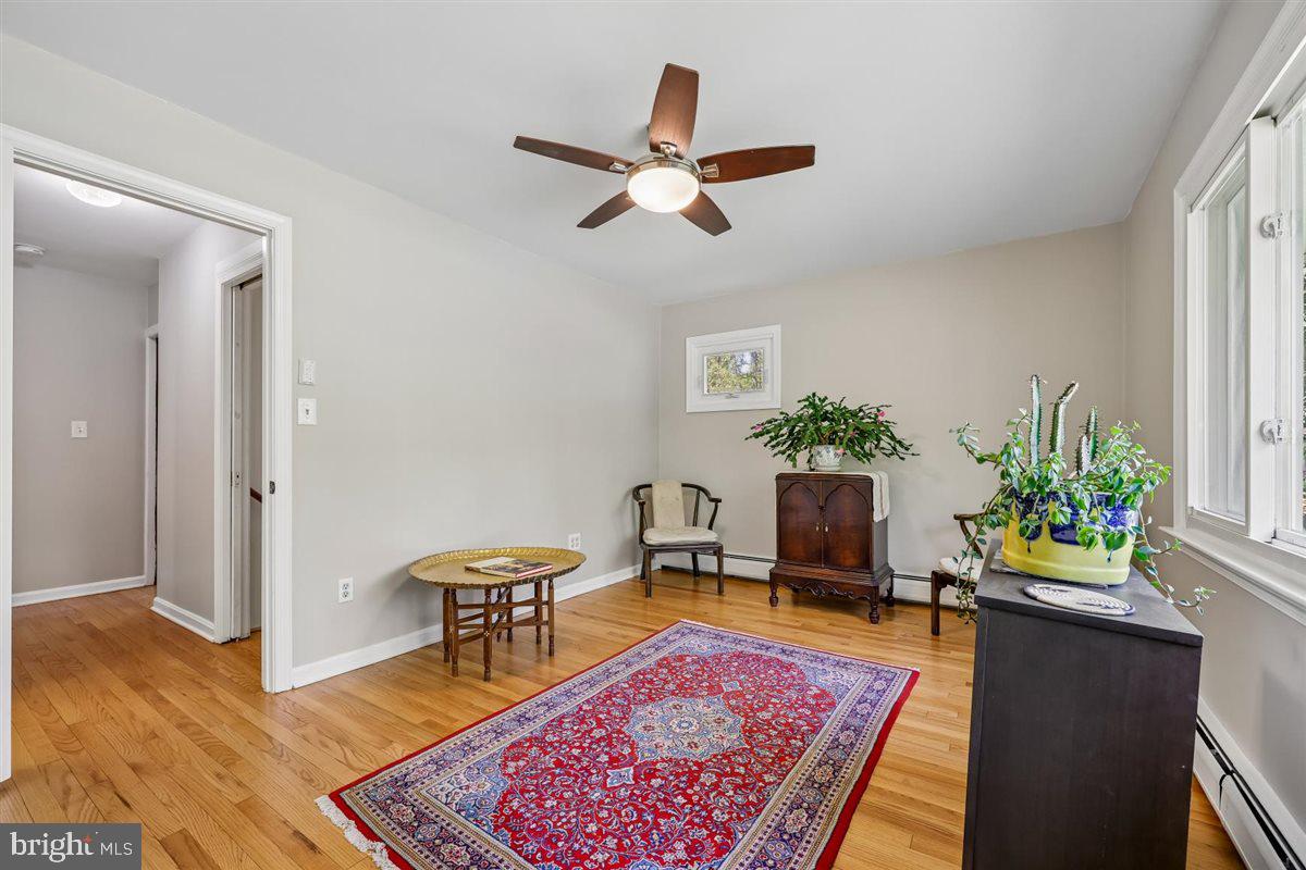 4318 Pinetree Road Rockville, MD 20853 - Photo 73 of 130 a living room with furniture and a potted plant