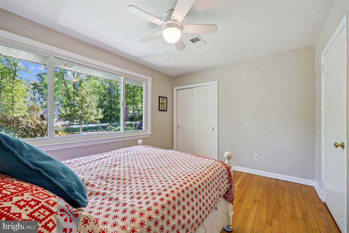 4318 Pinetree Road Rockville, MD 20853 - Photo 81 of 130 a bedroom with a bed and a large window